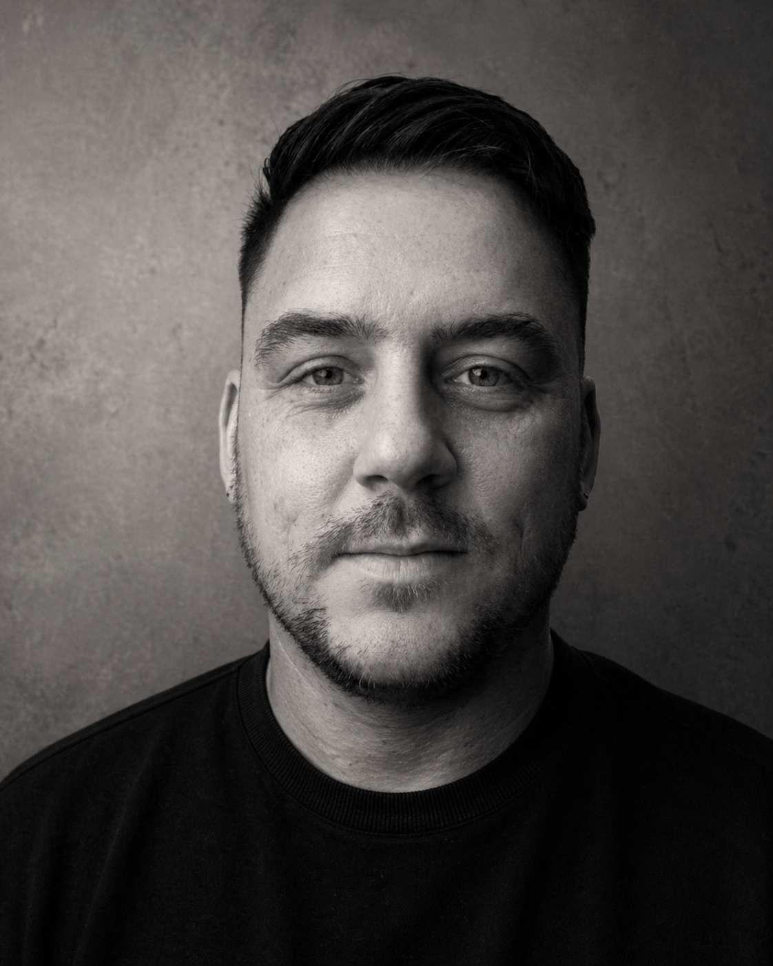 Black and white documentary portrait of Jay Wheeler